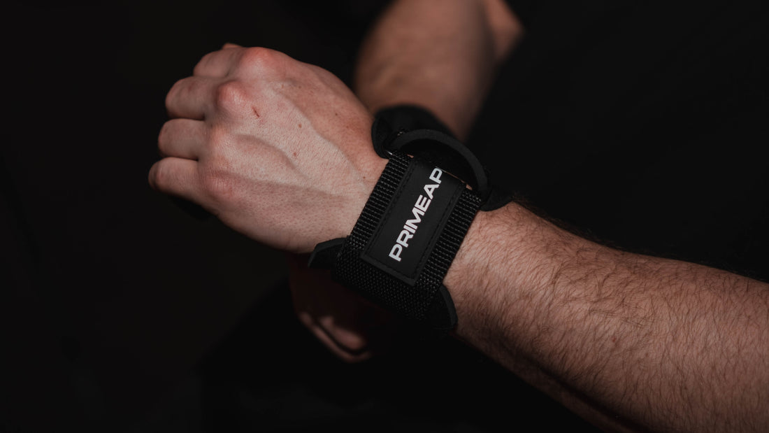 hands of a person wearing a Prime Ape figure 8 lifting strap on their wrist, showcasing its durable design and snug fit.